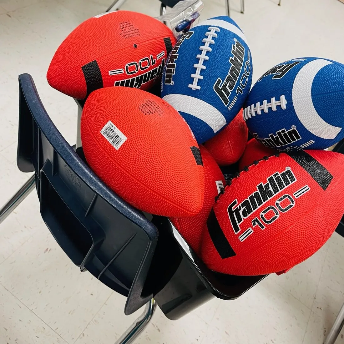 New footballs delivered to a classroom at the Jewett School of the Arts